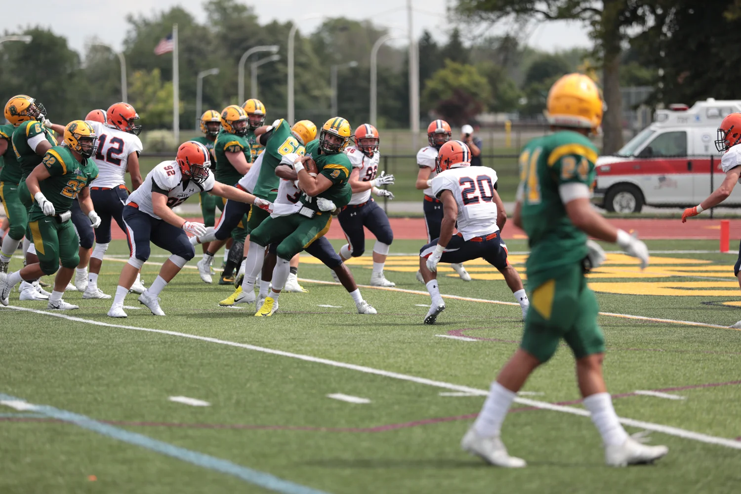 Brockport QB running to the endzone while being tackled
