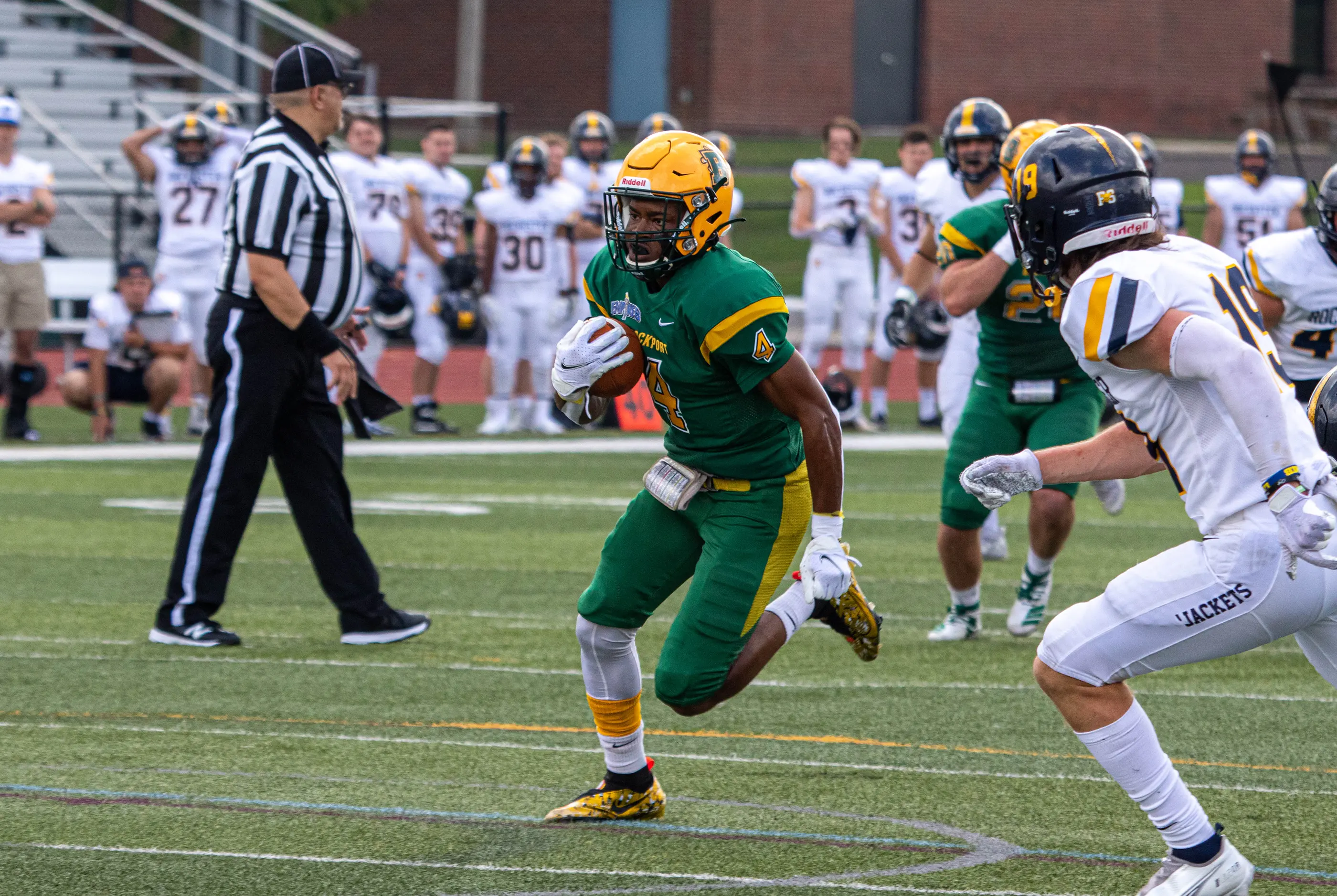 Brockport WR running down the field with the ball to the endzone