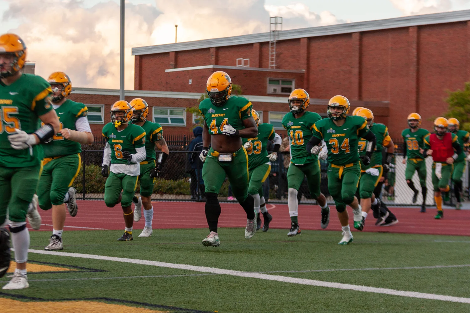 Brockport running onto the field