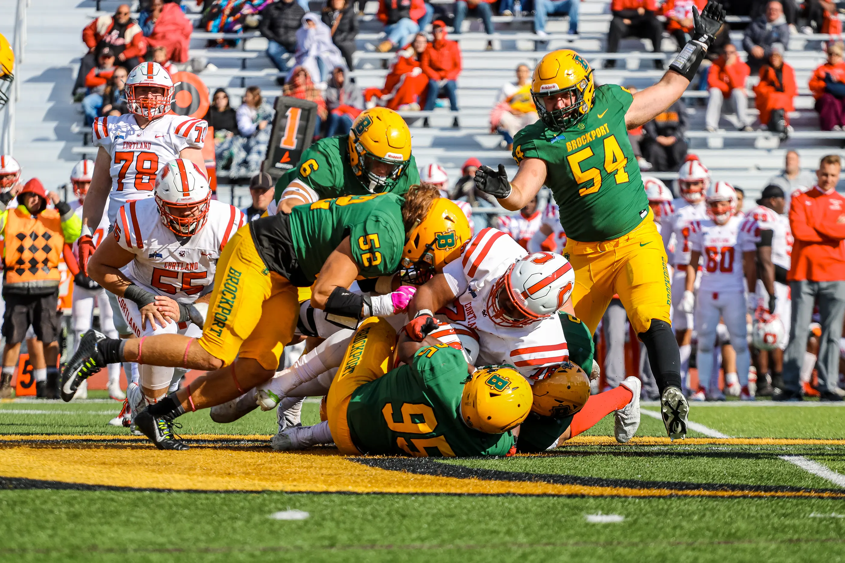 Brockport Football making the tackle against Cortland