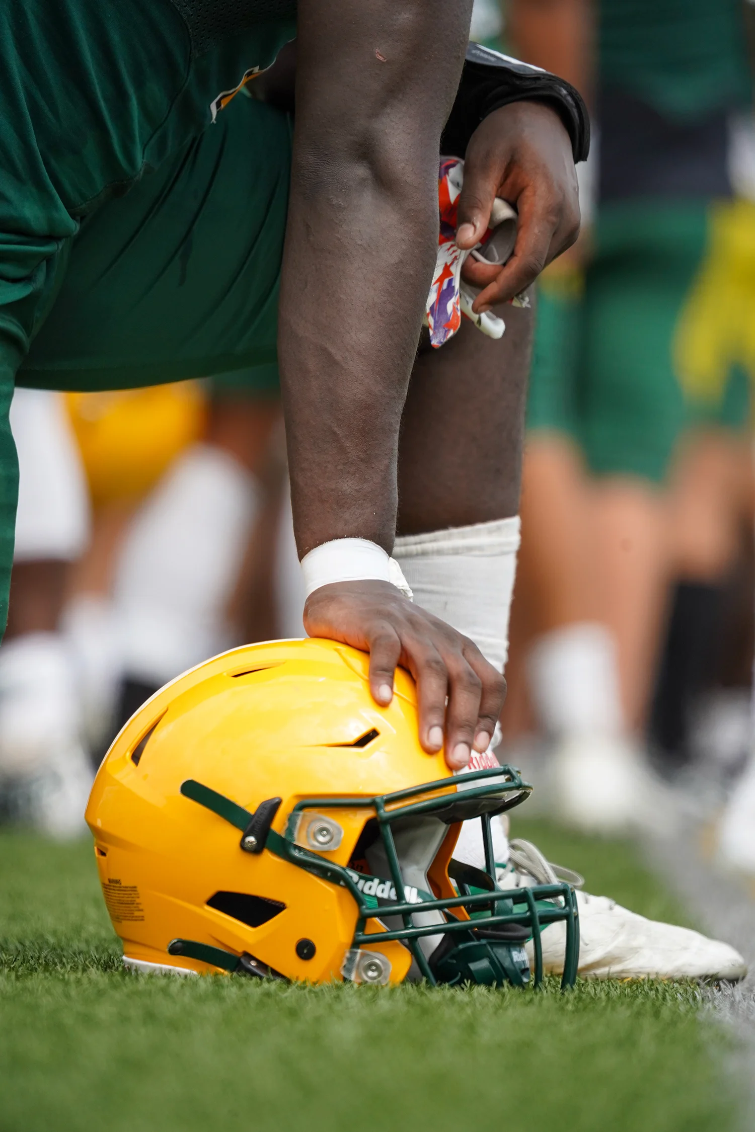 Brockport Player leaning on this helmet