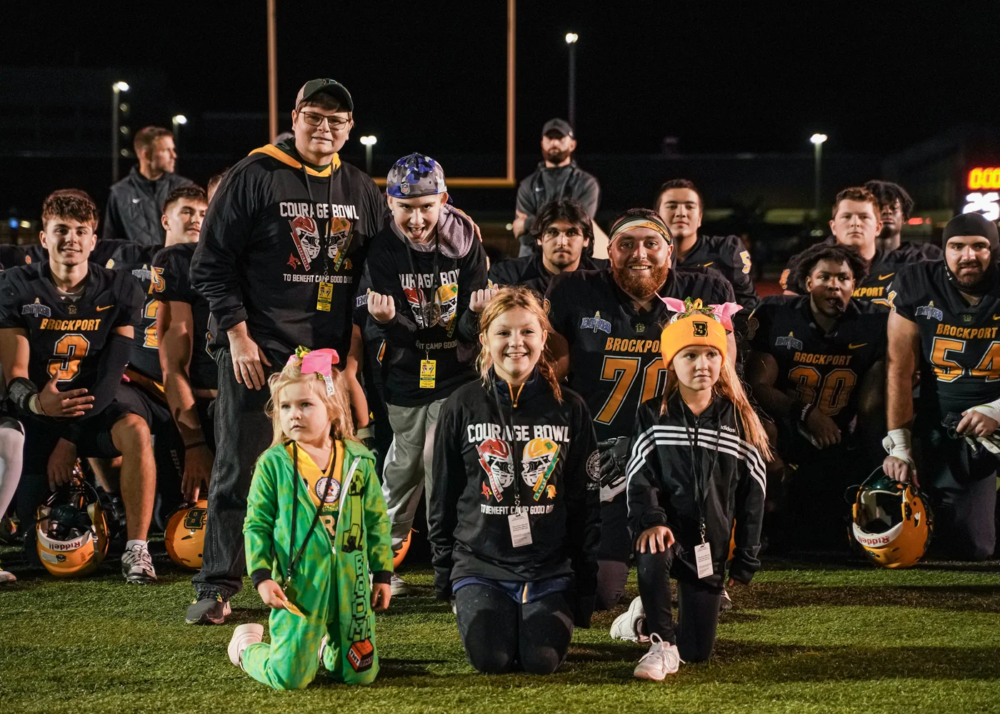 The Heros posing with the team after the Win