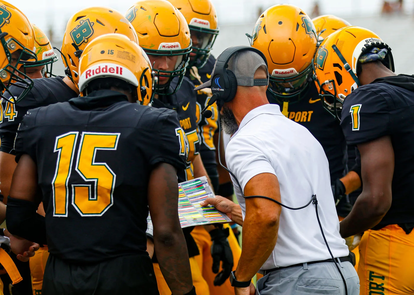 Coach Mangone giving the play in the huddle